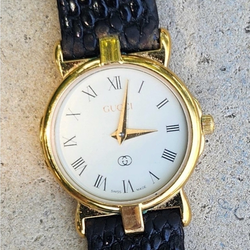 Gucci Women's Watch with Gold Case and Black Strap